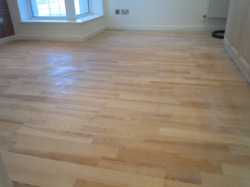 Polished wood floor soiled by building mess